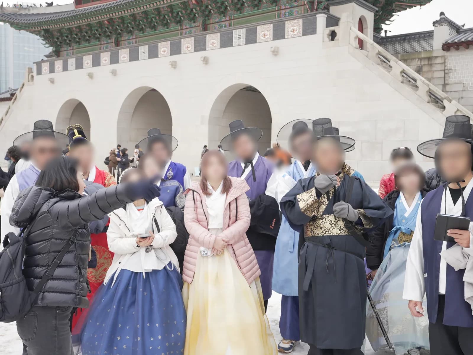 A second group of participants in hanbok at Gyeongbokgung Palace, showing a range of traditional styles